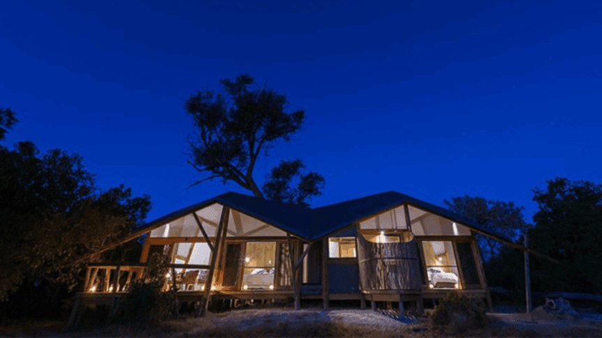 A night time photo of the Splash Enclave Camp