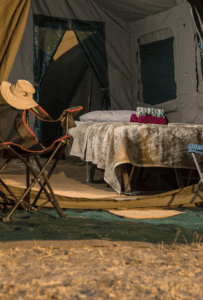 A camping chair, a bed, a tent, mobile safari at Letaka Northern Highlights. Book with Think Africa Travel