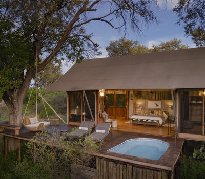 View of the double bedroom exterior at Tuludi Camp in Botswana