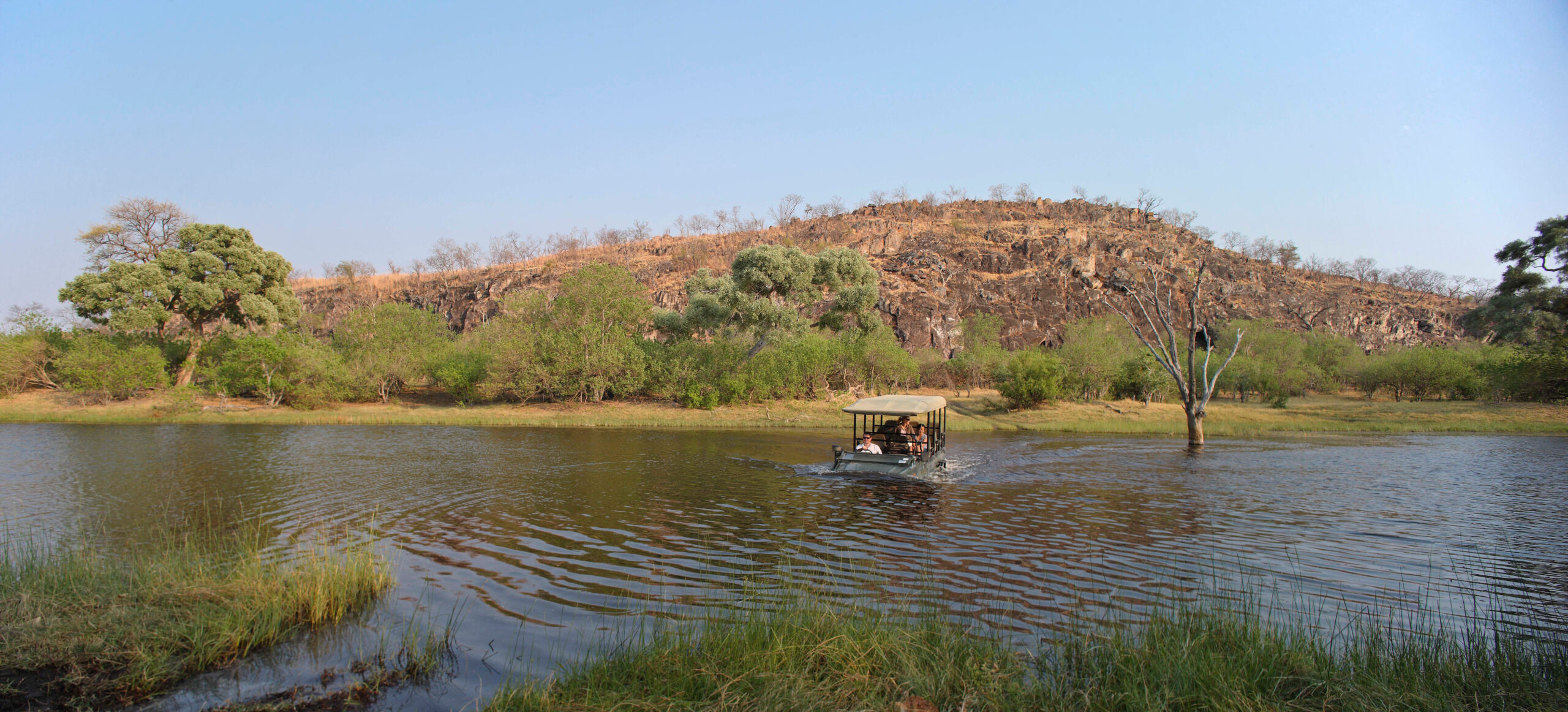 Botswana-Savute-Under-Canvas-Experience-Game-drive-vehicle-in-the-water-High-Resolution-Width=5000px